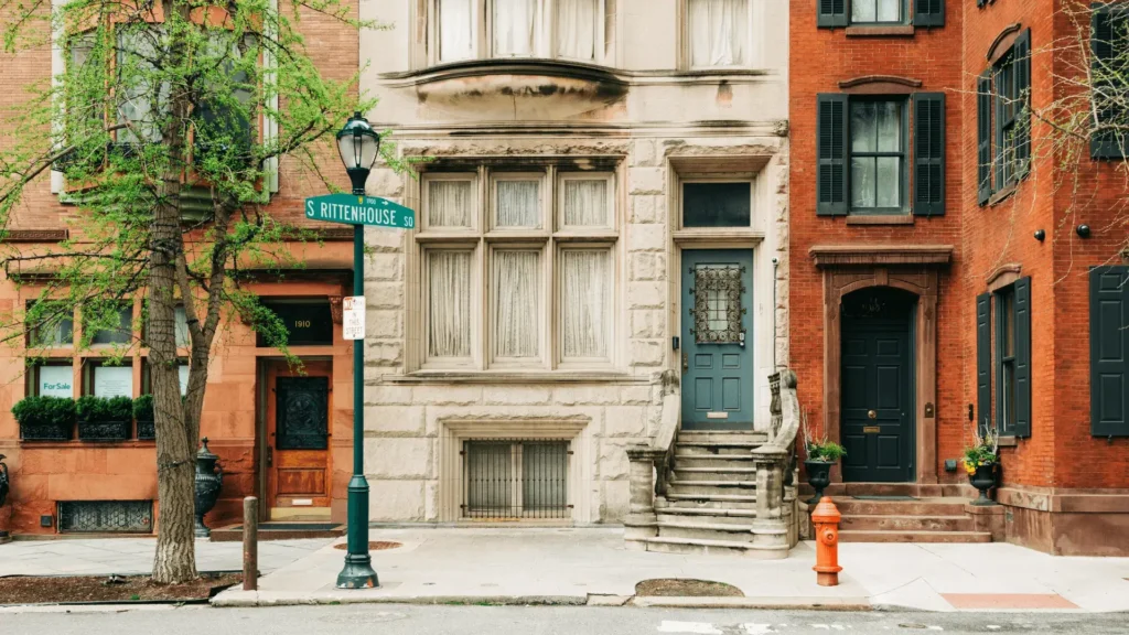 Historic brownstone building facade featuring restored windows and sills in NYC