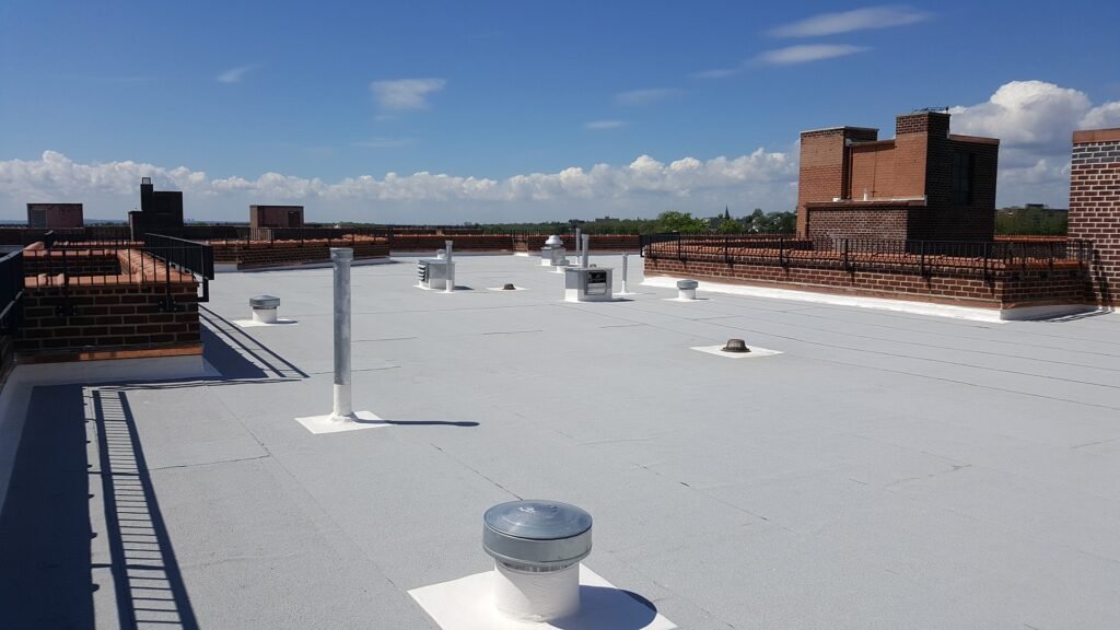 Flat roof waterproofing and protective coating application for brownstone buildings in NYC